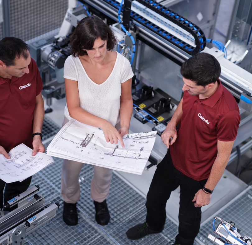 Engineer explaining turnkey automation to assembly operator