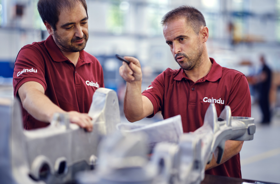 Assembly operators selecting spare parts for automatic machines to be sent to the customer.